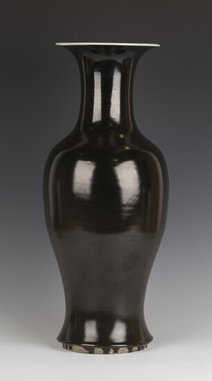 A Chinese dark brown/black glazed porcelain vase, Kangxi period, of baluster form with flared neck