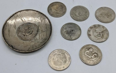 A Chinese silver coin dish together with 7 Chinese