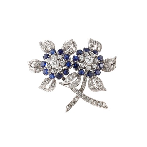 A DIAMOND AND SAPPHIRE BROOCH, mounted in 18ct gold, of flor...