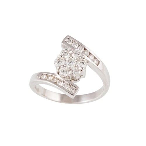A DIAMOND CLUSTER RING, of cross over design, the diamonds m...