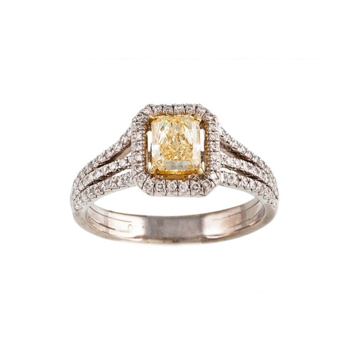 A DIAMOND CLUSTER RING, the centre fancy yellow rectangular ...