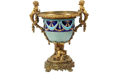 A FRENCH GILT BRONZE AND SEVRES STYLE PORCELAIN URN, 19TH CENTURY