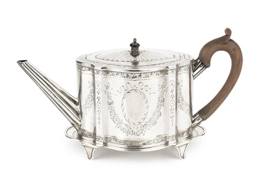 A George III silver teapot, of shaped oval outline, bright-cut...