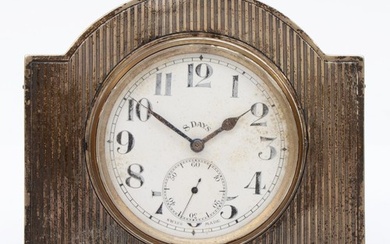 A George V silver mounted 8 day key less wind desk clock, by...