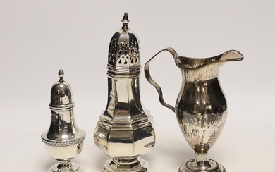 A George V silver pepperette, a silver plated sugar caster a...
