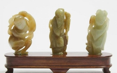 A Group of Three White and Celadon Jade Figures, 19th