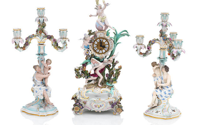 A Meissen clock on stand and two candelabra