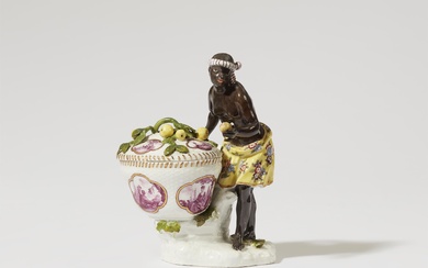 A Meissen porcelain figure of an African woman with a basket