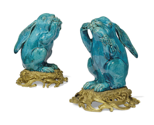 A PAIR OF FRENCH ORMOLU-MOUNTED PORCELAIN TURQUOISE GLAZED MODELS OF HARES, 19TH CENTURY