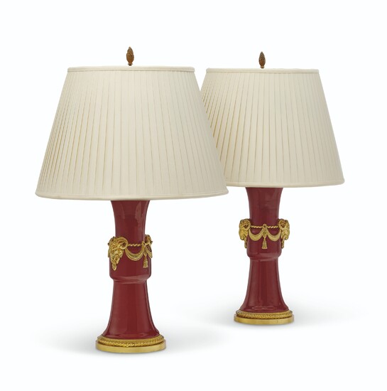 A PAIR OF ORMOLU-MOUNTED CHINESE COPPER RED-GLAZED PORCELAIN VASES, MOUNTED AS LAMPS, THE MOUNTS FRENCH, CIRCA 1860, THE PORCELAIN 18TH/EARLY19TH CENTURY