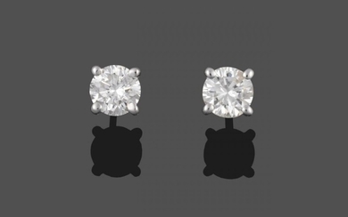 A Pair of Diamond Solitaire Earrings, round brilliant cut diamonds...