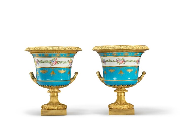 A Pair of Restauration Gilt Bronze-Mounted Bleu Celeste Sèvres Porcelain Urns, Circa 1820, the Porcelain Later Decorated