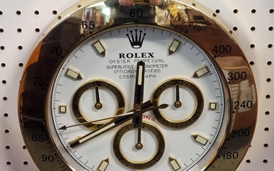A Rolex style wall clock, 34cm diameter. ...