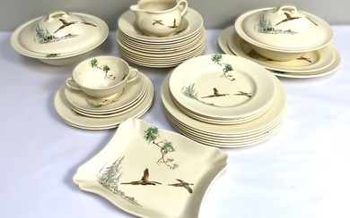 A Royal Doulton part dinner service, all decorated with a brace of pheasants, including two