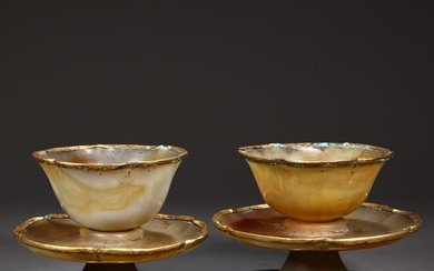 A SET OF AGATE CUPS, WITH SAUCERS.