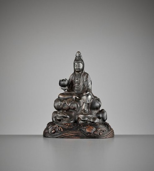 A SILVERED ‘ROYAL EASE’ BRONZE FIGURE OF GUANYIN,...