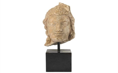 A SMALL STUCCO BODHISATTVA HEAD Hadda or Fondukistan, Afghanistan, 3rd - 5th century