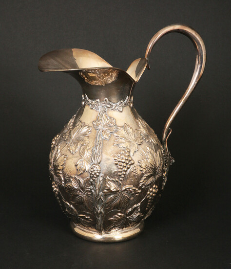 A SPANISH SILVER WATER JUG REPOUSEE GRAPES AND LEAVES