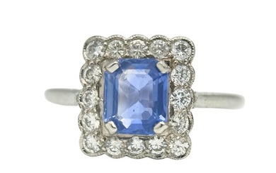 A Sapphire And Diamond Cluster Ring in platinum, set with a ...