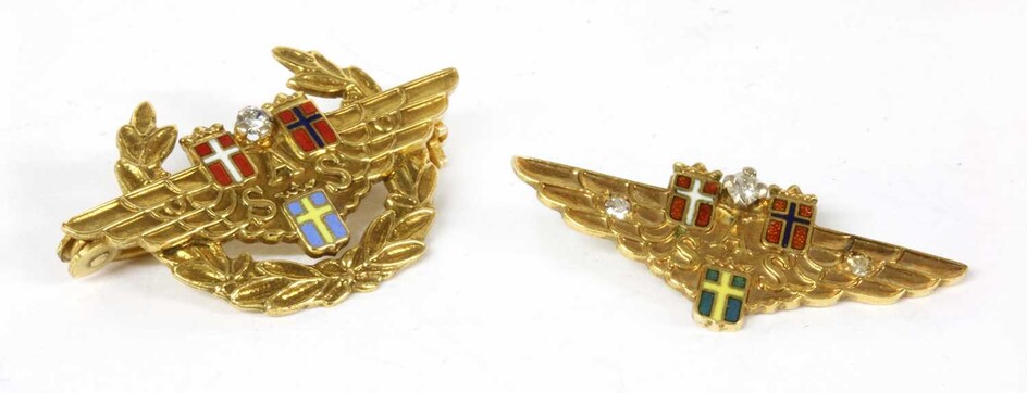 A Scandinavian Airlines gold diamond and enamel brooch
