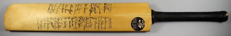 A Slazenger Cricket Bat, 1960s, autographed to front by...