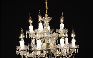 A Small Vintage Eight Branch Glass Chandelier. The C-scroll arms emanating from a central pressed gl