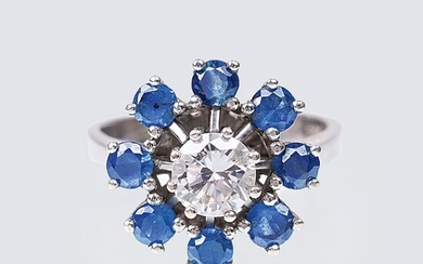 A Solitaire Diamond Ring with Sapphires.