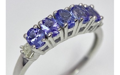 A Tanzanite and Diamond Ring. Set in 925 silver. Size O.