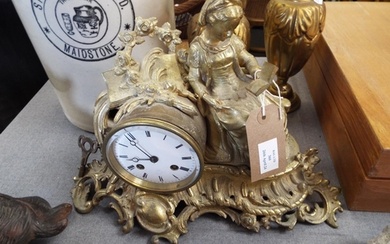 A Victorian gilt bronze mantle clock with bell strike and a ...