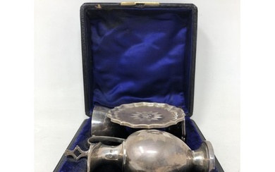 A Victorian silver communion set, comprising a chalice, ewer...
