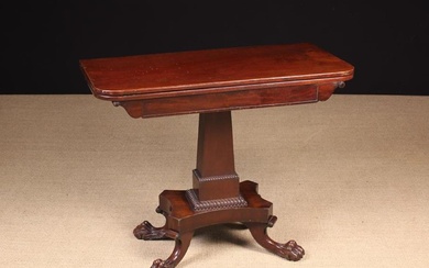 A William IV Mahogany Fold-Over Tea Table. The hinged, revolving top with rounded corners and a fold