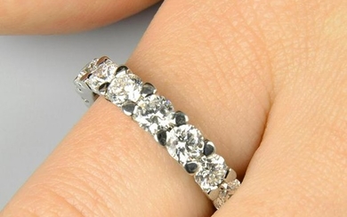 A brilliant-cut diamond tapered full eternity ring.