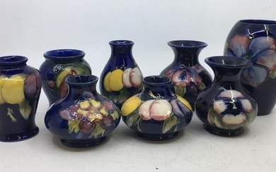 A collection of eight Moorcroft art pottery vases. H:13cm (tallest)...