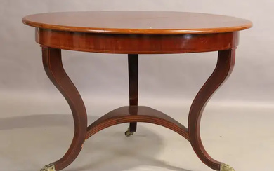 A continental line inlaid mahogany centre table, 19th century, the circular top...