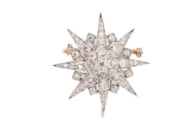 A diamond set star brooch