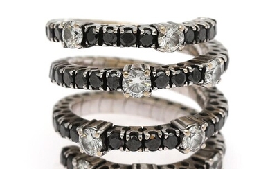 NOT SOLD. A flexible diamond ring set with nine white diamonds weighing a total of app. 1.35 ct. and numerous black diamonds, mounted in 18k white gold. Size app. 55. – Bruun Rasmussen Auctioneers of Fine Art