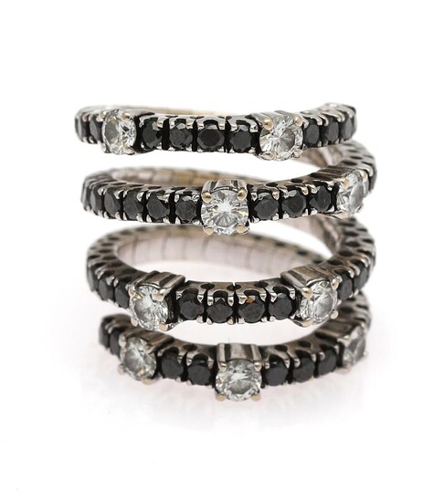 NOT SOLD. A flexible diamond ring set with nine white diamonds weighing a total of app. 1.35 ct. and numerous black diamonds, mounted in 18k white gold. Size app. 55. – Bruun Rasmussen Auctioneers of Fine Art