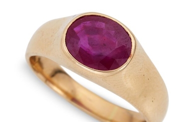 A fourteen karat gold and ruby ring the oval-cut...