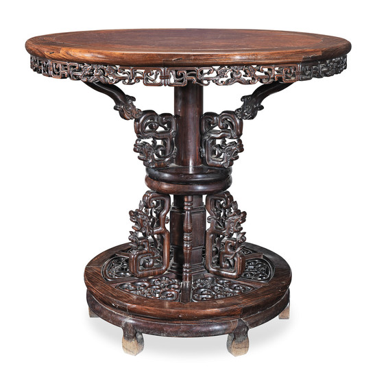 A hongmu and burlwood revolving circular table