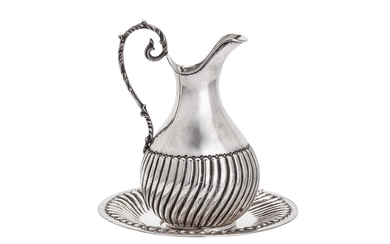 A mid-late 20th century Turkish 900 standard silver jug and under plate, stamped 900 and SK