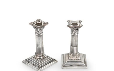 A pair of Elizabeth II silver library candlesticks