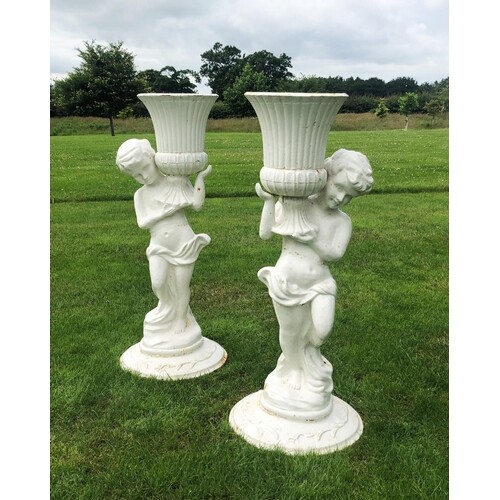 A pair of cast iron figural jardinieres, white painted, each...