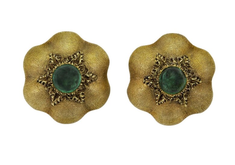 A pair of emerald earclips by Buccellati, each of textured sixfoil flower design centring on a single cabochon emerald, one signed Buccellati, both stamped Italy K18