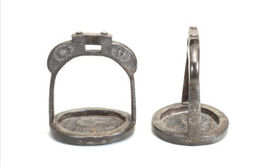 A pair of inlaid iron stirrups