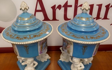 A pair of large Sevres style powder blue porcelain vases and...