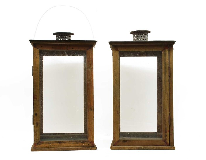 A pair of wooden framed garden lanterns with tin-plate tops and funnels