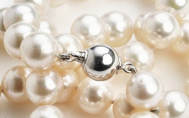 NOT SOLD. A pearl necklace set with numerous cultured Akoya pearls with a clasp of...