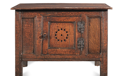 A rare Elizabeth I joined oak and elm splayed livery cupboard or food-hutch, circa 1560