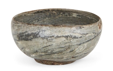 A rare Korean 'yeonrimun' marbled pottery bowl, Goryeo dynasty, 12th century, on short foot with convex sides, composed of dark grey, light grey and ivory-coloured clay mixed together to create a marbled effect, covered in an allover clear glaze...