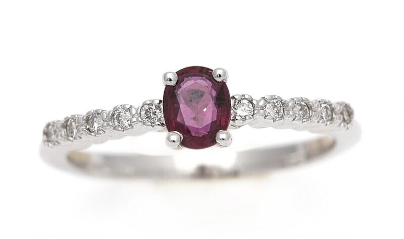 NOT SOLD. A ruby and diamond ring set with an oval-cut ruby weighing app. 0.45 ct. flanked by numerous brilliant-cut diamonds, mounted in 18k white gold. Size 54. – Bruun Rasmussen Auctioneers of Fine Art